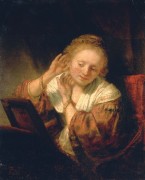Девушка, примеряющая серьги - Рембрандт, Харменс ван Рейн