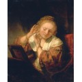 Девушка, примеряющая серьги - Рембрандт, Харменс ван Рейн