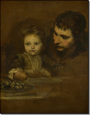 Мужчина и ребенок едят виноград